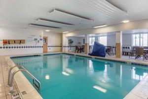 a large swimming pool with blue water at Comfort Inn Charlotte in Charlotte