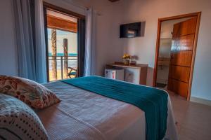 Postel nebo postele na pokoji v ubytování Mar Egeu Arte & Pouso