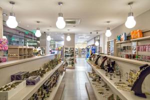 a store aisle with lots of shoes on display at Lagomandra Hotel and Spa in Lagomandra
