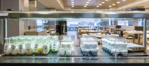 a glass counter with a bunch of bottles of milk at Ilunion Calas de Conil in Conil de la Frontera