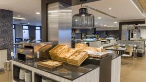 a kitchen with a counter with baskets on it at Ilunion Calas de Conil in Conil de la Frontera