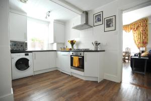 
A kitchen or kitchenette at Beechurst Serviced Apartments
