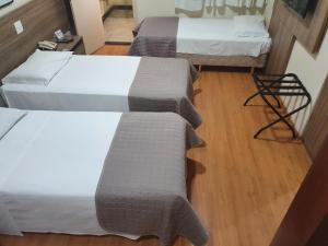 Cama ou camas em um quarto em Via Contorno Hotel