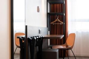 a dining room with a table and chairs at B&B HOTEL Antwerpen Centrum in Antwerp