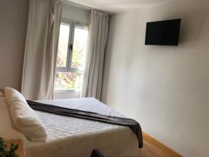 TV a/nebo společenská místnost v ubytování Hotel Villa de los Arcos