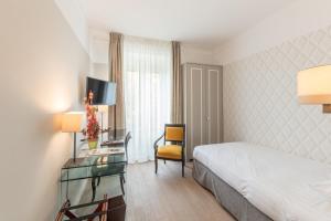 Postel nebo postele na pokoji v ubytování Hotel Victoria