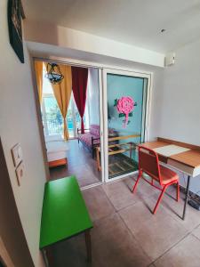 a living room with a table and a green table at Damask Rose, Lebanese Guest House in Jounieh