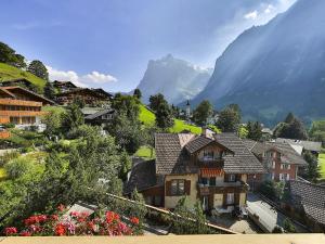 a view of a village with a mountain in the background at Apartment Chalet Abendrot apARTments-14 by Interhome in Grindelwald