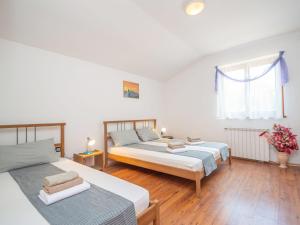 Un ou plusieurs lits dans un hébergement de l'établissement Apartment Vinka - ROJ434 by Interhome