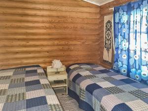Postel nebo postele na pokoji v ubytování Holiday Home Savenaho by Interhome
