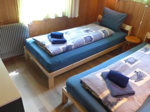 A bed or beds in a room at Chalet Egg-Isch by Interhome