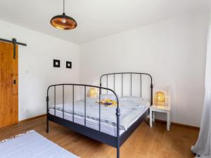 a bedroom with a metal bed in a room at Holiday Home Brníčko by Interhome in Brníčko