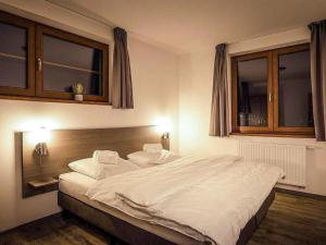 Postel nebo postele na pokoji v ubytování Holiday Home Residence Lipno by Interhome