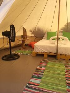 Voodi või voodid majutusasutuse Glamping Due Amici toas
