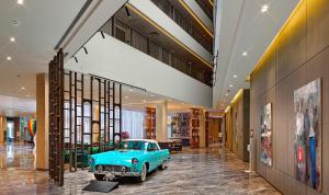 an old blue car is in a hallway at Wanda Vista Istanbul in Istanbul