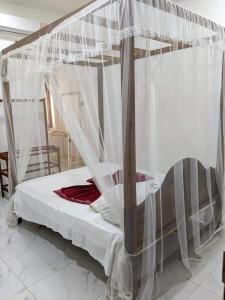 Postel nebo postele na pokoji v ubytování Blooming Villa & Guest