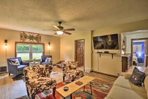 a living room with a couch and chairs and a ceiling fan at Altmar Family Home with Rivers and Trails Nearby! in Pulaski