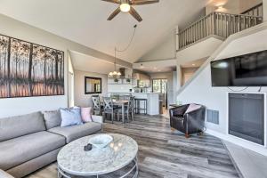 a living room with a couch and a tv at Gorgeous Bend Condo with Community Hot Tub! in Bend