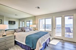 a bedroom with a bed and a balcony at Hiking Trail and Hot Tub Access Bend Condo with Deck in Bend +24 photos