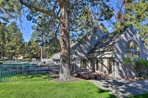 a church with a tree in the yard at Hiking Trail and Hot Tub Access Bend Condo with Deck in Bend
