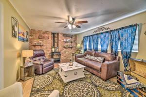 a living room with two couches and a ceiling fan at 1 Mi to Canyon Tours Vibrant Page Paradise! in Page