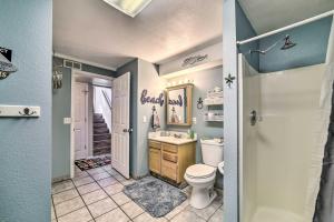 a bathroom with a toilet and a sink at 1 Mi to Canyon Tours Vibrant Page Paradise! in Page +27 photos