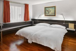 Postelja oz. postelje v sobi nastanitve Hotel du Commerce