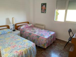 Posteľ alebo postele v izbe v ubytovaní Apartamento Costa del Sol