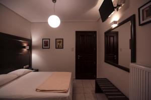 Postel nebo postele na pokoji v ubytování Hotel Meteora