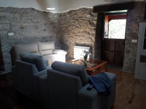 Posezení v ubytování Casa rural en Asturias a orillas del río Narcea puerta de Somiedo