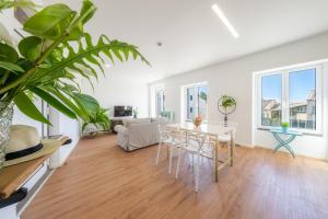 a living room with a table and chairs at Casa Amarela Apartments - by Casas na Ilha in Câmara de Lobos