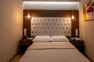 Postel nebo postele na pokoji v ubytování Hotel Meteora