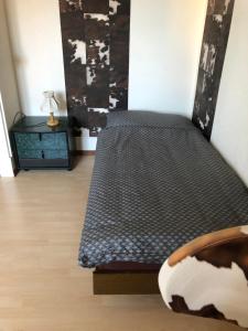 Postel nebo postele na pokoji v ubytování Chambres d'Hotes Le Passiflore