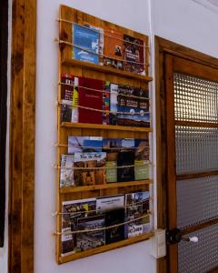 a stack of books on a wall next to a door at Casa Tato Figuerola d'Orcau in Figuerola de Orcau
