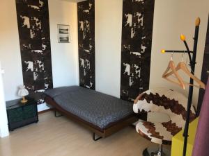 Postel nebo postele na pokoji v ubytování Chambres d'Hotes Le Passiflore
