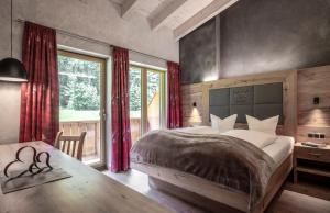 Letto o letti in una camera di Seehotel St Hubertus