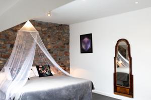 Letto o letti in una camera di Chemin de Traverse