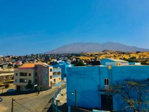 a view of a city with mountains in the background at Txon DFogo Pensão Restaurante in São Filipe