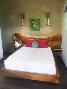 Voodi või voodid majutusasutuse Hotel FAREMITI Uvita toas