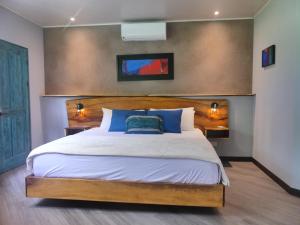 Voodi või voodid majutusasutuse Hotel FAREMITI Uvita toas