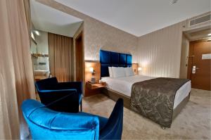Postel nebo postele na pokoji v ubytování Riva Reşatbey Luxury Hotel