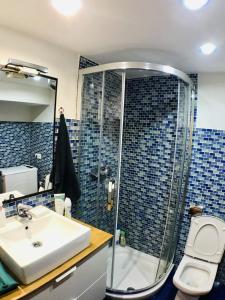 a bathroom with a sink and a shower and a toilet at Casa Bernardita in Colunga +15 photos