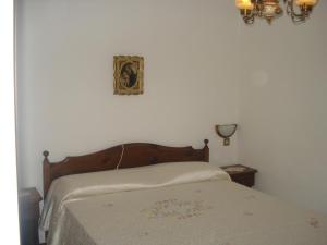 מיטה או מיטות בחדר ב-Albergo Larese