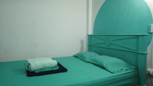 Postel nebo postele na pokoji v ubytování Acuarela Hostal