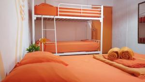 Postel nebo postele na pokoji v ubytování Acuarela Hostal