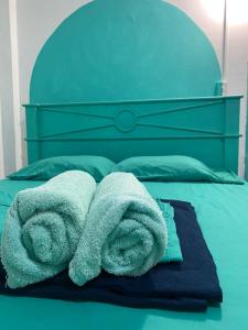 Postel nebo postele na pokoji v ubytování Acuarela Hostal