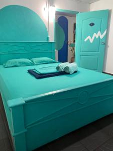 Postel nebo postele na pokoji v ubytování Acuarela Hostal