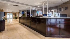 a lobby with a reception counter in a hospital at Best Western Concord Inn and Suites in Concord