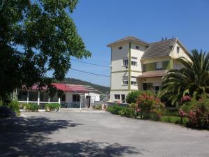 a parking lot in front of a building at El Parador in San Vicente de la Barquera