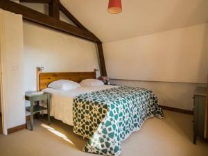 Un pat sau paturi într-o cameră la Gapard La Grange